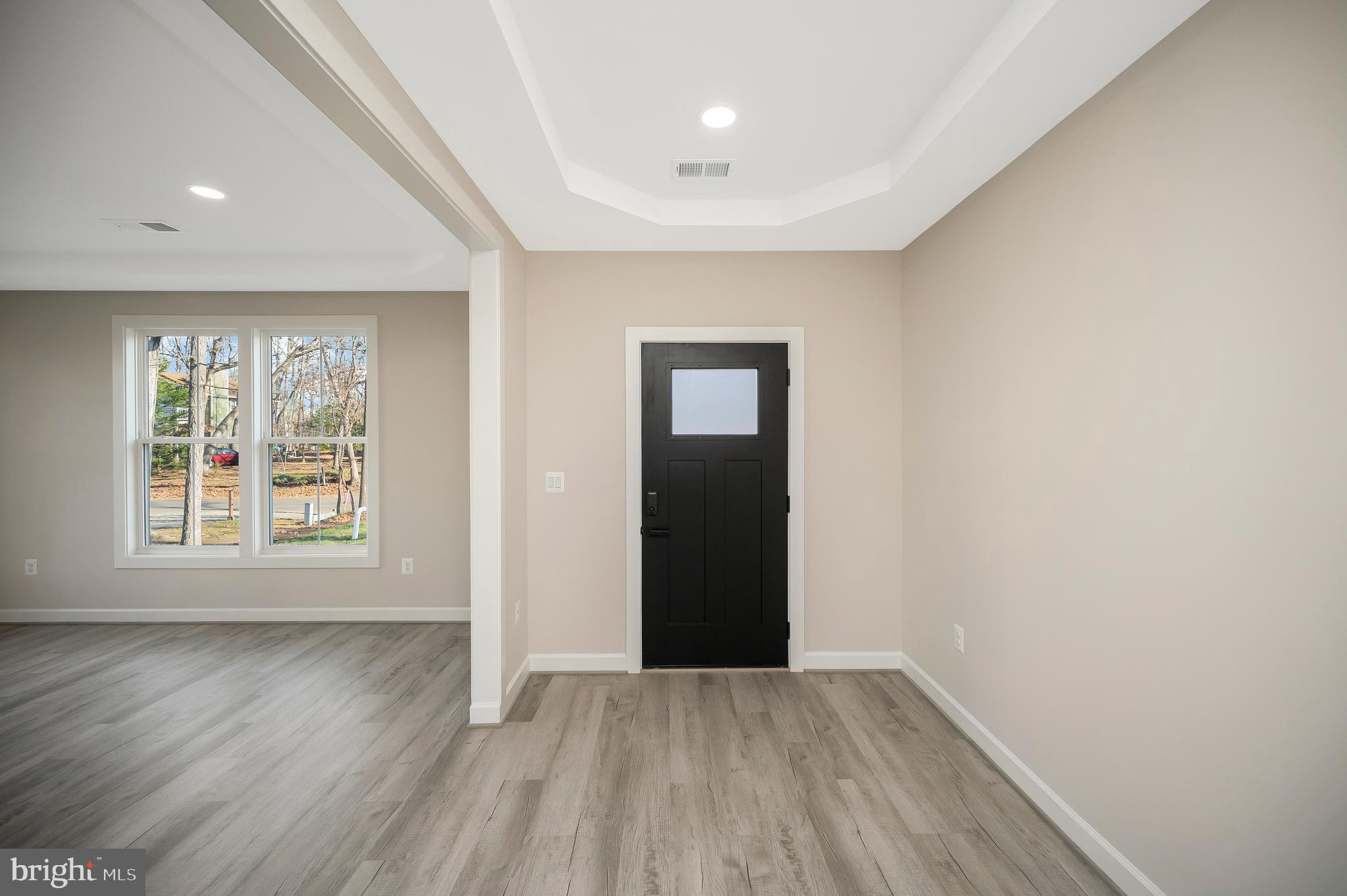 430 Liberty Boulevard Locust Grove, VA 22508 - Photo 12 of 66 an empty room with wooden floor and windows