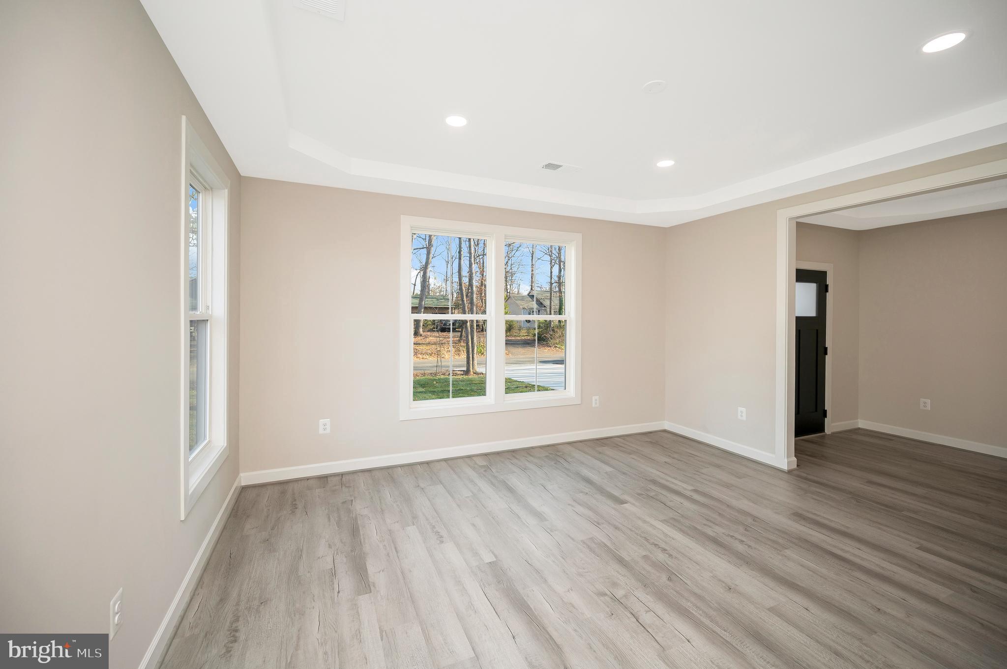 430 Liberty Boulevard Locust Grove, VA 22508 - Photo 14 of 66 a view of an empty room with wooden floor and a window
