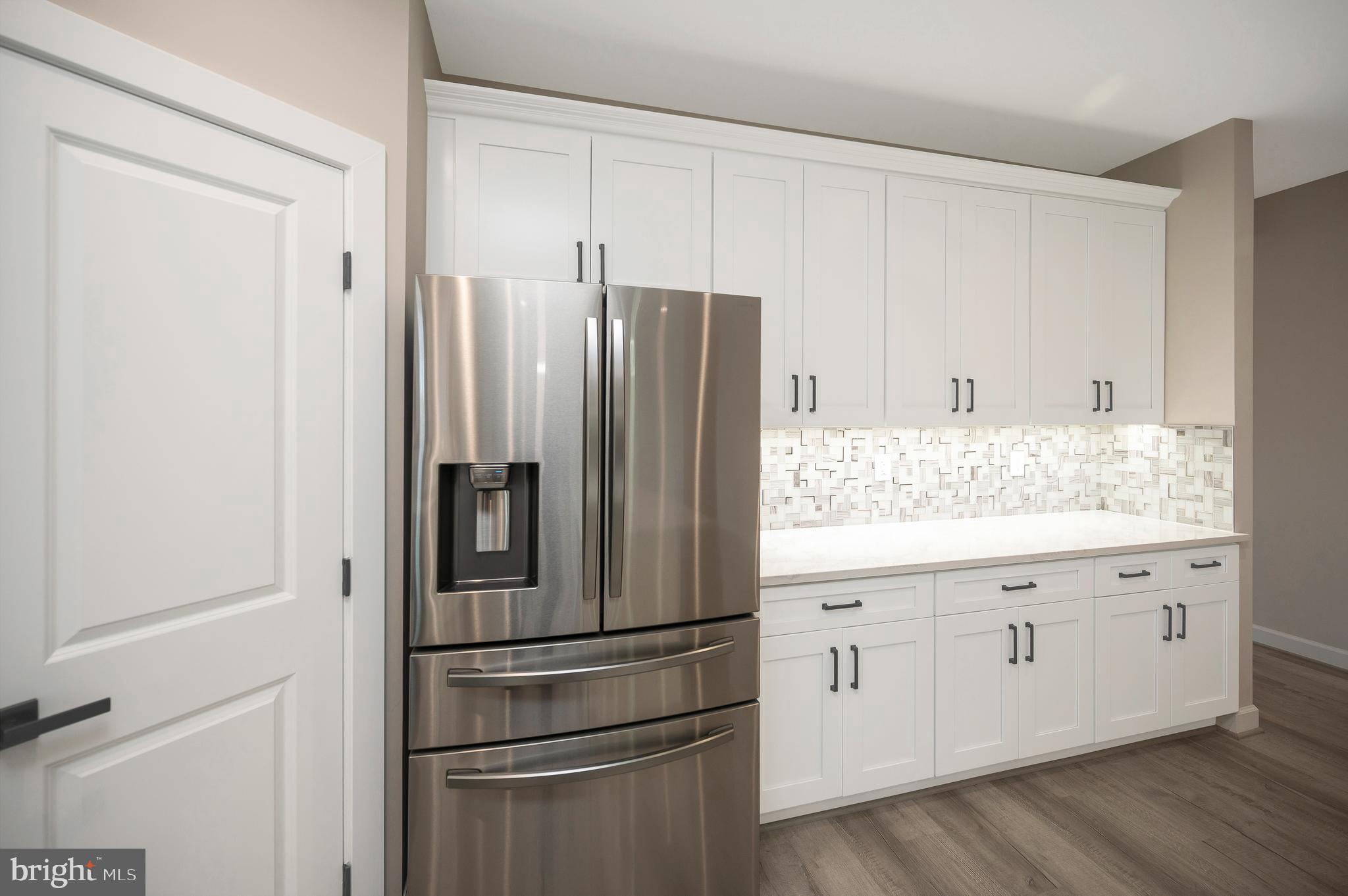 430 Liberty Boulevard Locust Grove, VA 22508 - Photo 23 of 66 a kitchen with granite countertop stainless steel appliances a refrigerator and cabinets