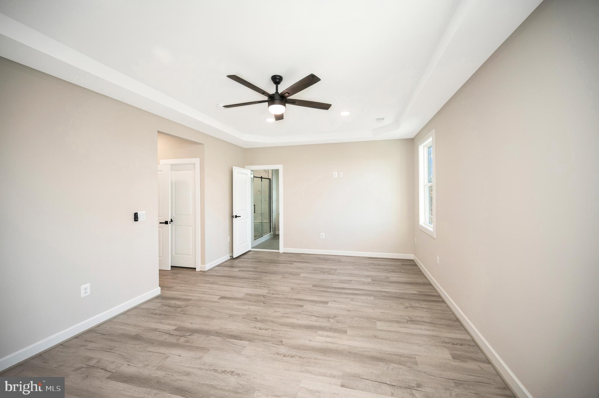 430 Liberty Boulevard Locust Grove, VA 22508 - Photo 38 of 66 a view of empty room with wooden floor and ceiling fan