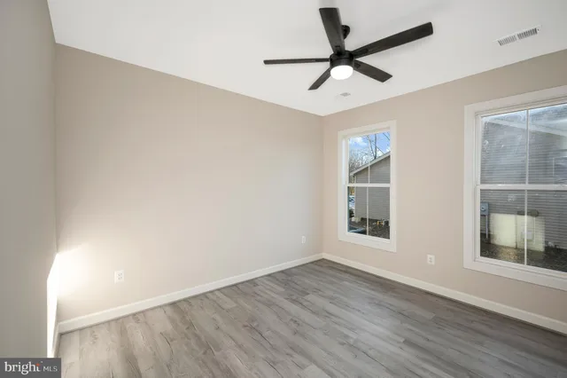 a view of a lake with outdoor seating space