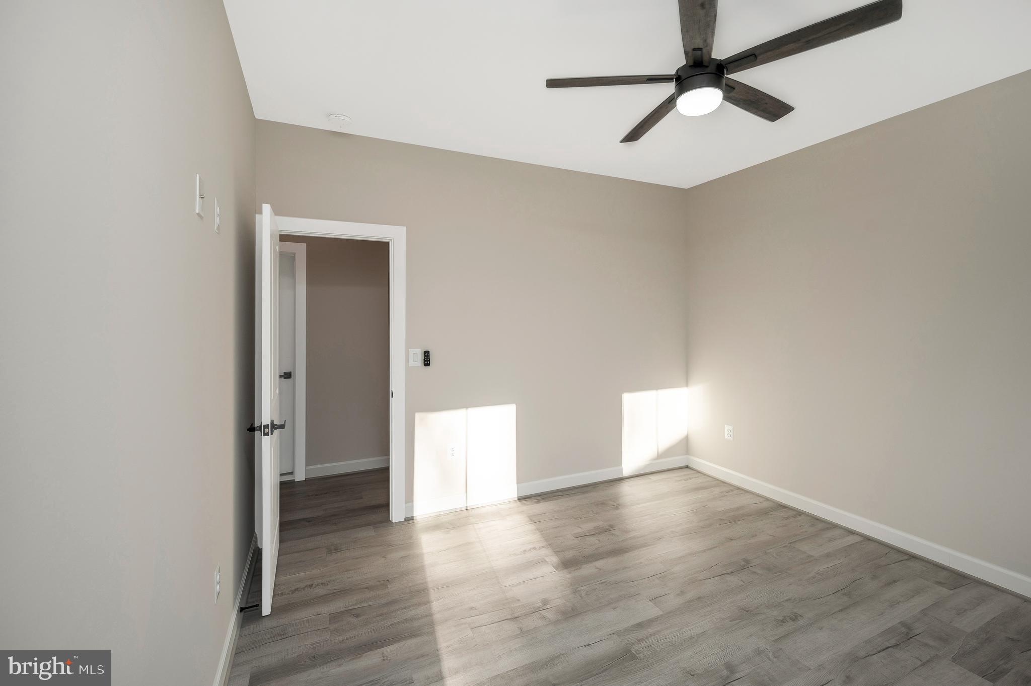 430 Liberty Boulevard Locust Grove, VA 22508 - Photo 44 of 66 a view of empty room with wooden floor and fan