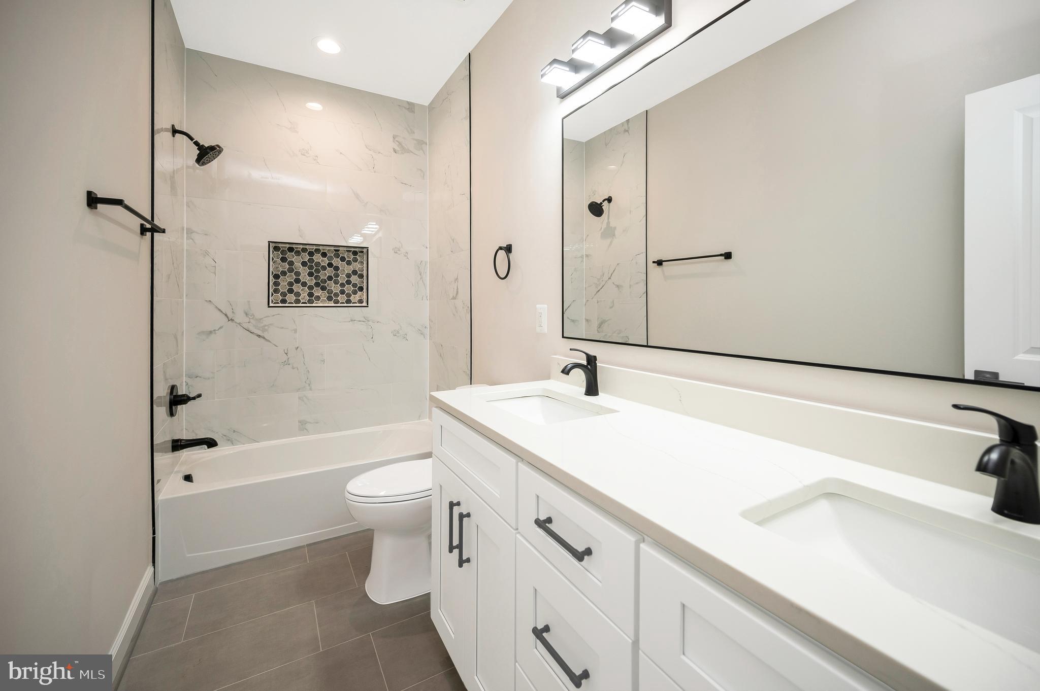 430 Liberty Boulevard Locust Grove, VA 22508 - Photo 46 of 66 a bathroom with a sink a toilet and shower