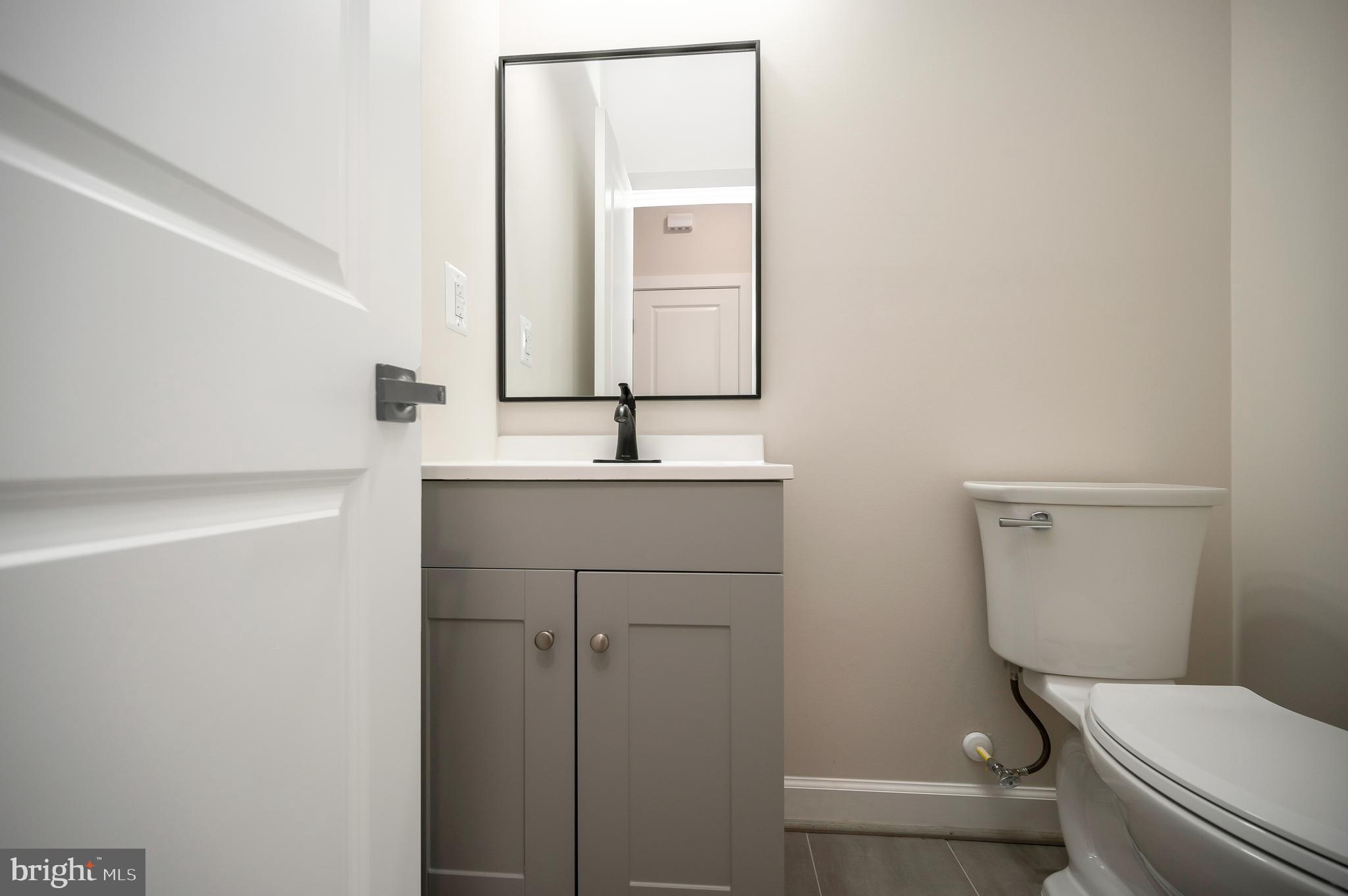 430 Liberty Boulevard Locust Grove, VA 22508 - Photo 49 of 66 a bathroom with a toilet sink and mirror