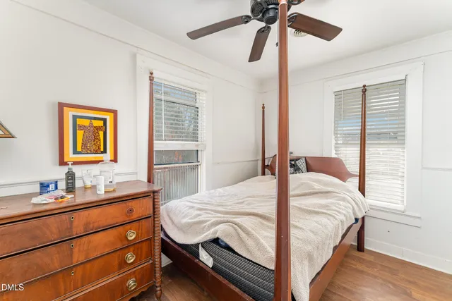 a bedroom with a bed and a dresser