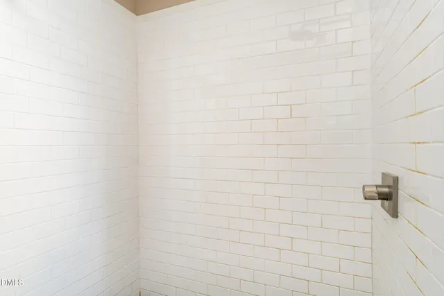 a view of a dining room with furniture and a window