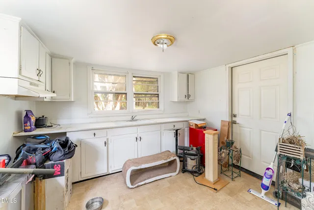 a view of a sink and a window