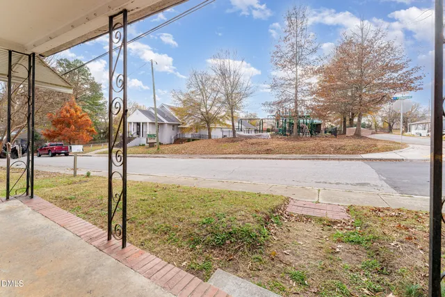 a front view of a house with large windows
