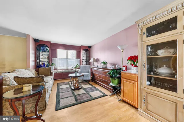 a bedroom with a bed lamp and a fireplace