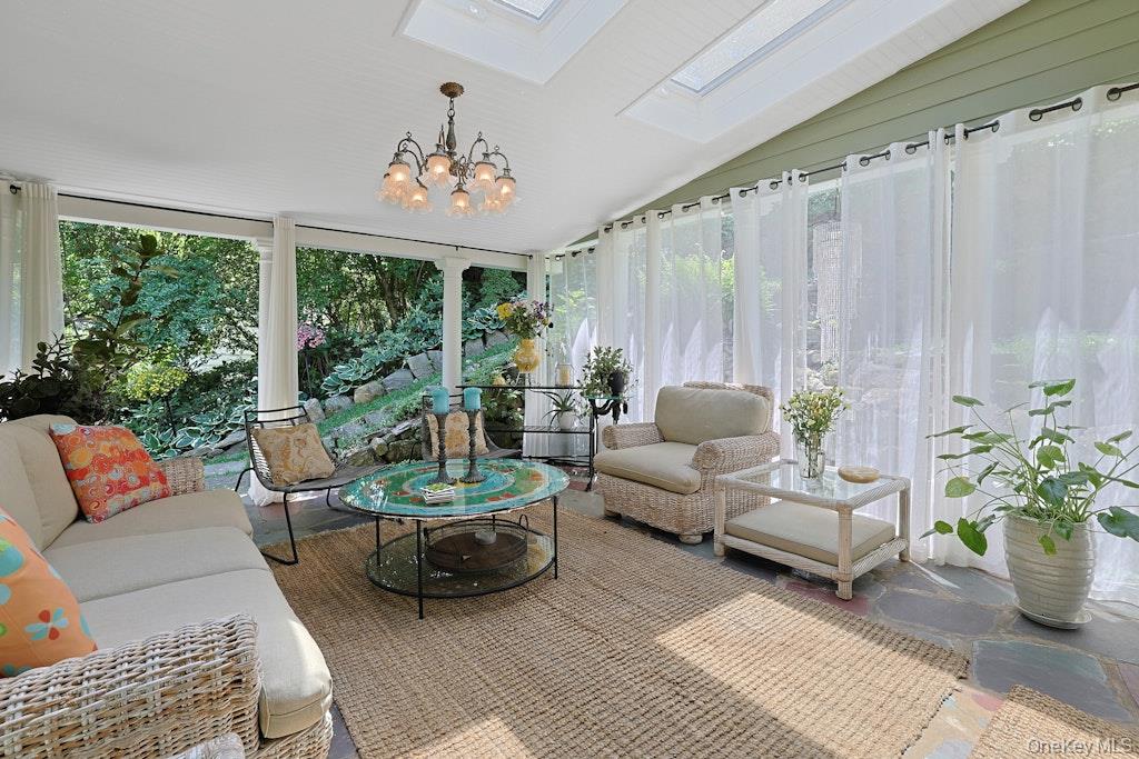 97 Underhill Road Scarsdale, NY 10583 - Photo 9 of 39 a living room with furniture and a large window
