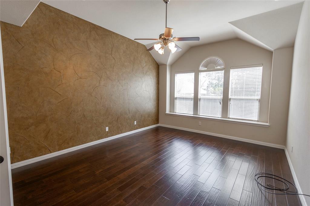 2931 Bandera Grand Prairie, TX 75054 - Photo 18 of 34 an empty room with wooden floor chandelier and windows