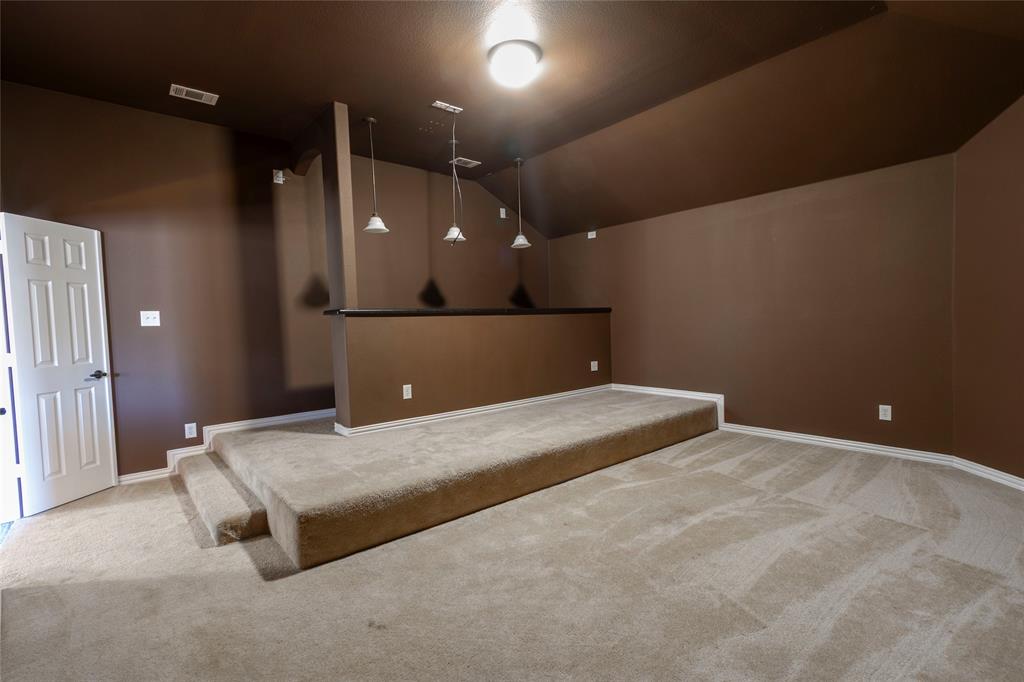 2931 Bandera Grand Prairie, TX 75054 - Photo 24 of 34 a bedroom with a bed and lamp