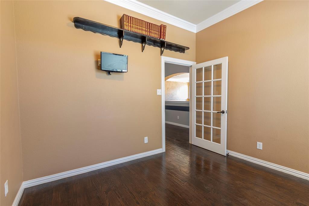 2931 Bandera Grand Prairie, TX 75054 - Photo 26 of 34 an empty room with wooden floor and windows