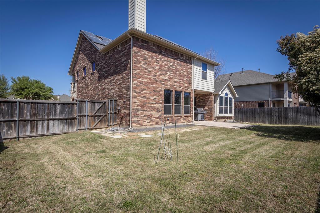 2931 Bandera Grand Prairie, TX 75054 - Photo 34 of 34 a view of a house with a yard and wooden fence