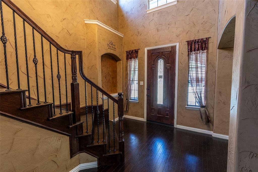 2931 Bandera Grand Prairie, TX 75054 - Photo 4 of 34 a view of entryway with wooden floor and stairs