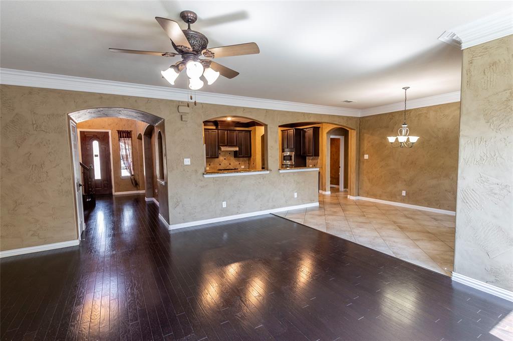 2931 Bandera Grand Prairie, TX 75054 - Photo 8 of 34 an open space with hardwood floor and a ceiling fan