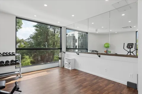 a view of a kitchen with a sink and wooden floor