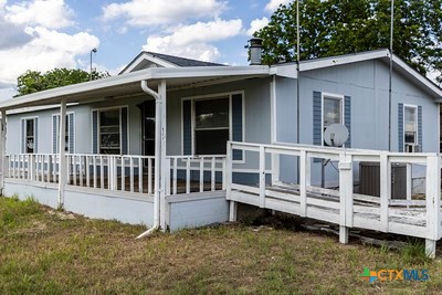 7805 Barbarosa Road New Braunfels, TX 78130 - Photo 3 of 24 front view of a house with a yard