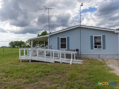 7805 Barbarosa Road New Braunfels, TX 78130 - Photo 4 of 24 a view of a house with a backyard