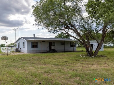 7805 Barbarosa Road New Braunfels, TX 78130 - Photo 5 of 24 a house that has a tree in front of it