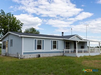 7805 Barbarosa Road New Braunfels, TX 78130 - Photo 7 of 24 a front view of a house with a yard