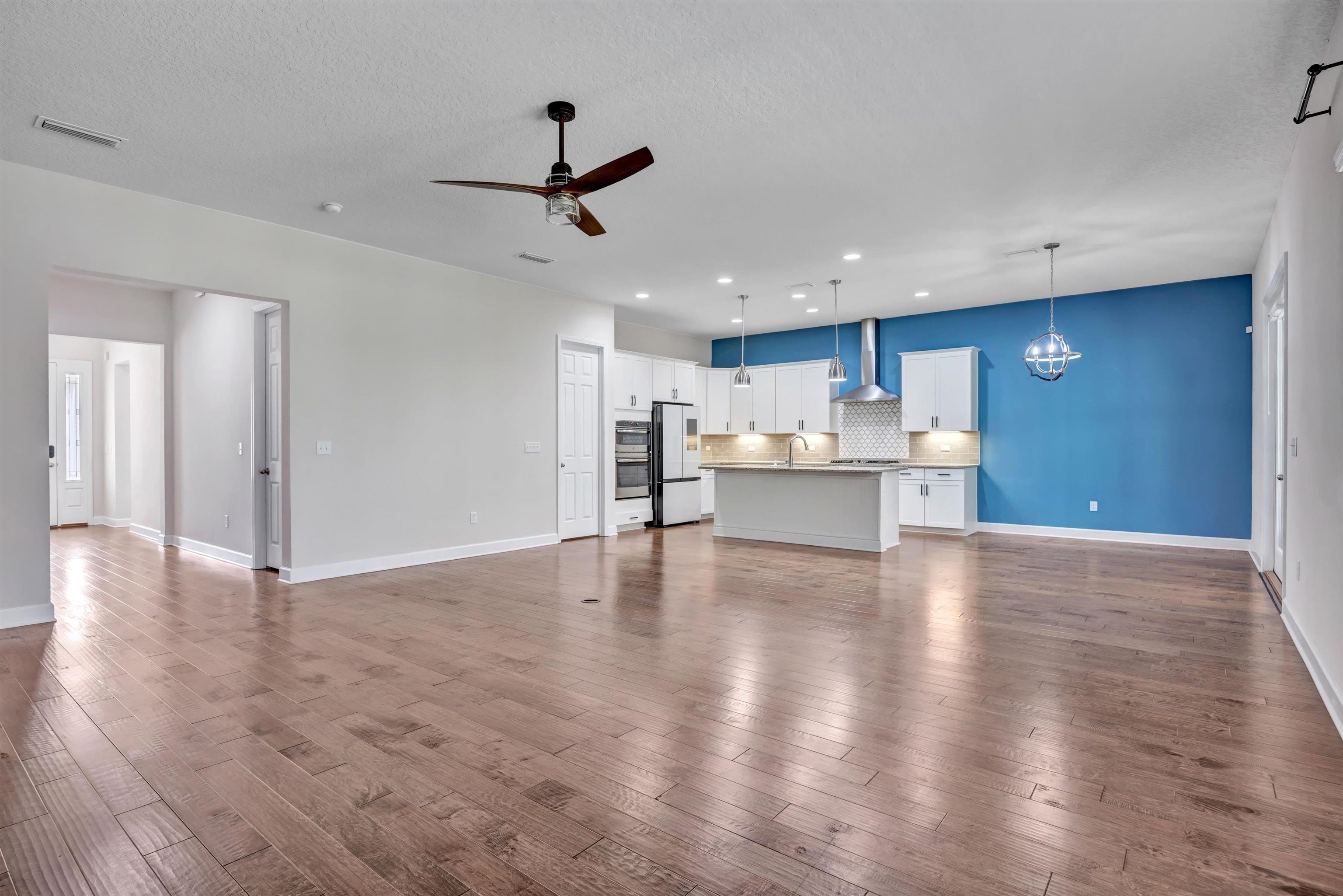 267 Downs Corner Road St. Augustine, FL 32092 - Photo 11 of 37 a view of a kitchen with a sink and wooden floor