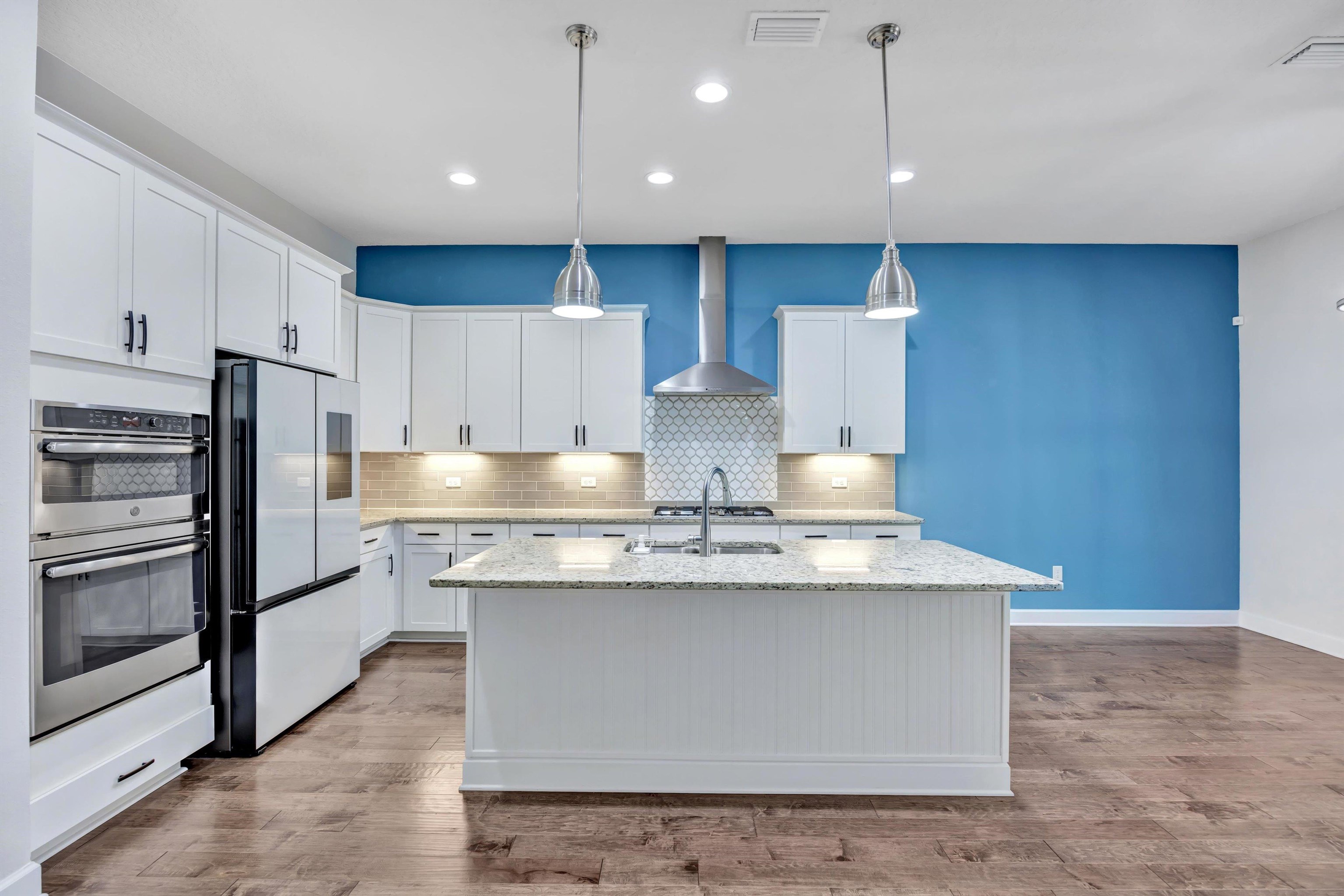 267 Downs Corner Road St. Augustine, FL 32092 - Photo 13 of 37 a kitchen with stainless steel appliances granite countertop a stove a refrigerator a sink and a oven