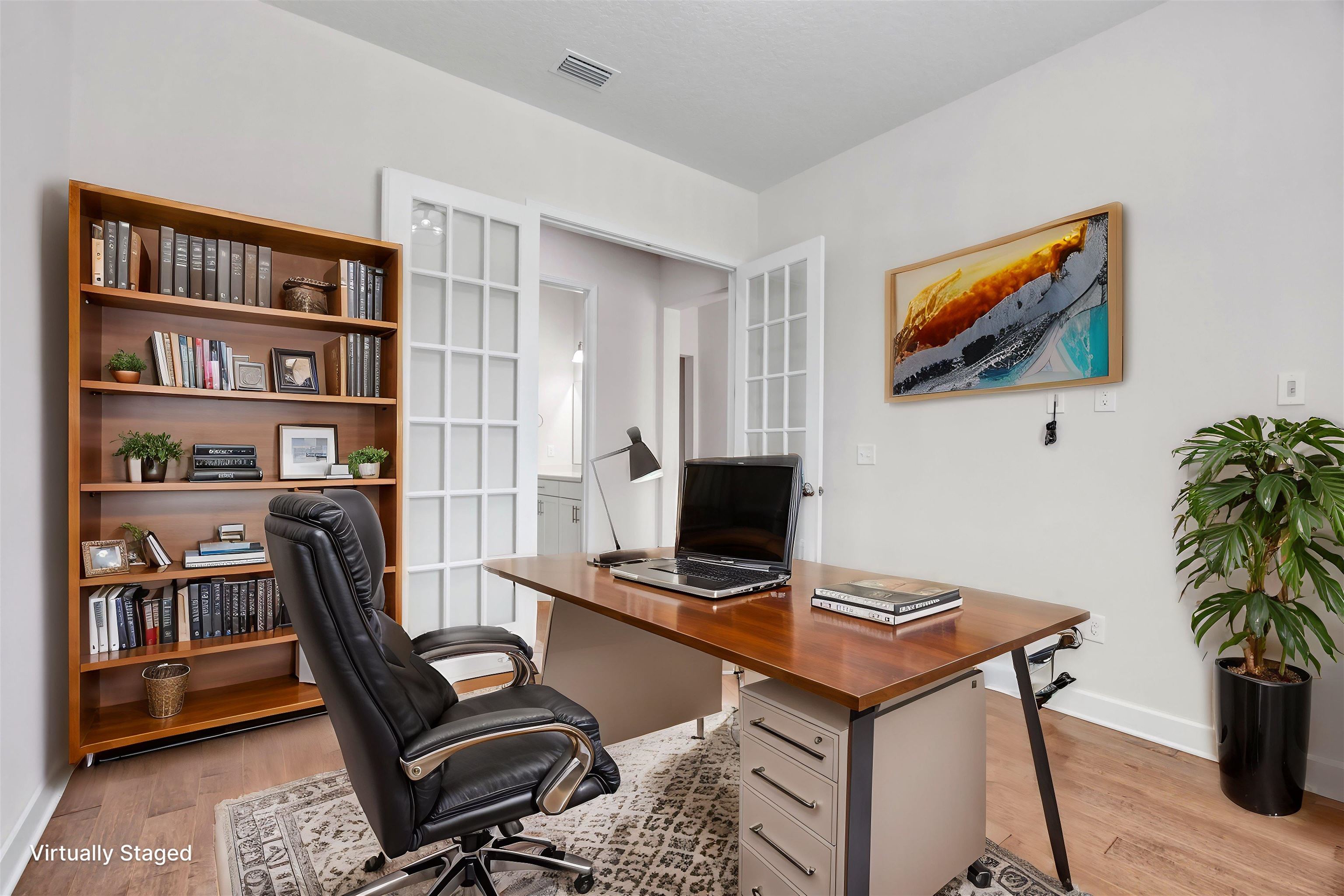 267 Downs Corner Road St. Augustine, FL 32092 - Photo 28 of 37 a view of a workspace with furniture and a bookshelf