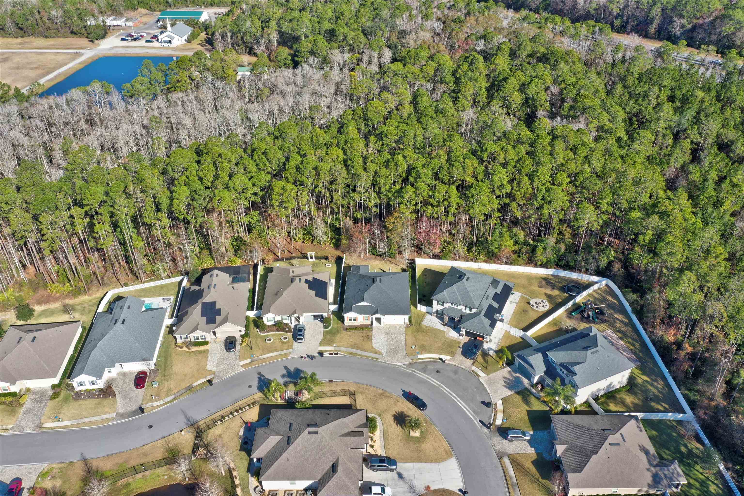 267 Downs Corner Road St. Augustine, FL 32092 - Photo 7 of 37 an aerial view of a house with a yard and lake view
