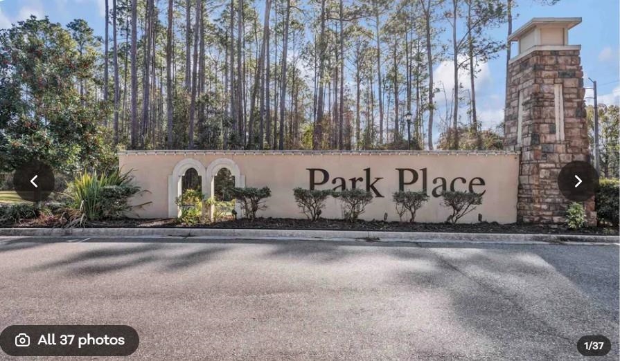 267 Downs Corner Road St. Augustine, FL 32092 - Photo 10 of 37 a street sign on a sidewalk next to a road