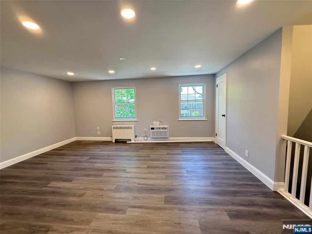 20 Clark Court Rutherford, NJ 07070 - Photo 8 of 29 an empty room with wooden floor and windows