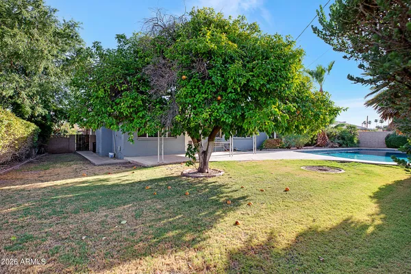 a view of a kitchen with a refrigerator and window