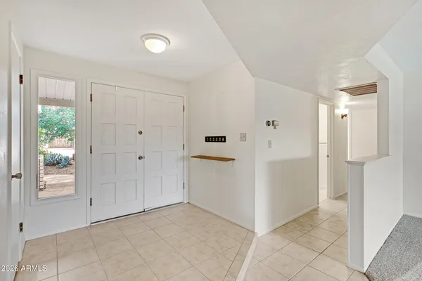 a kitchen with granite countertop a stove and a sink