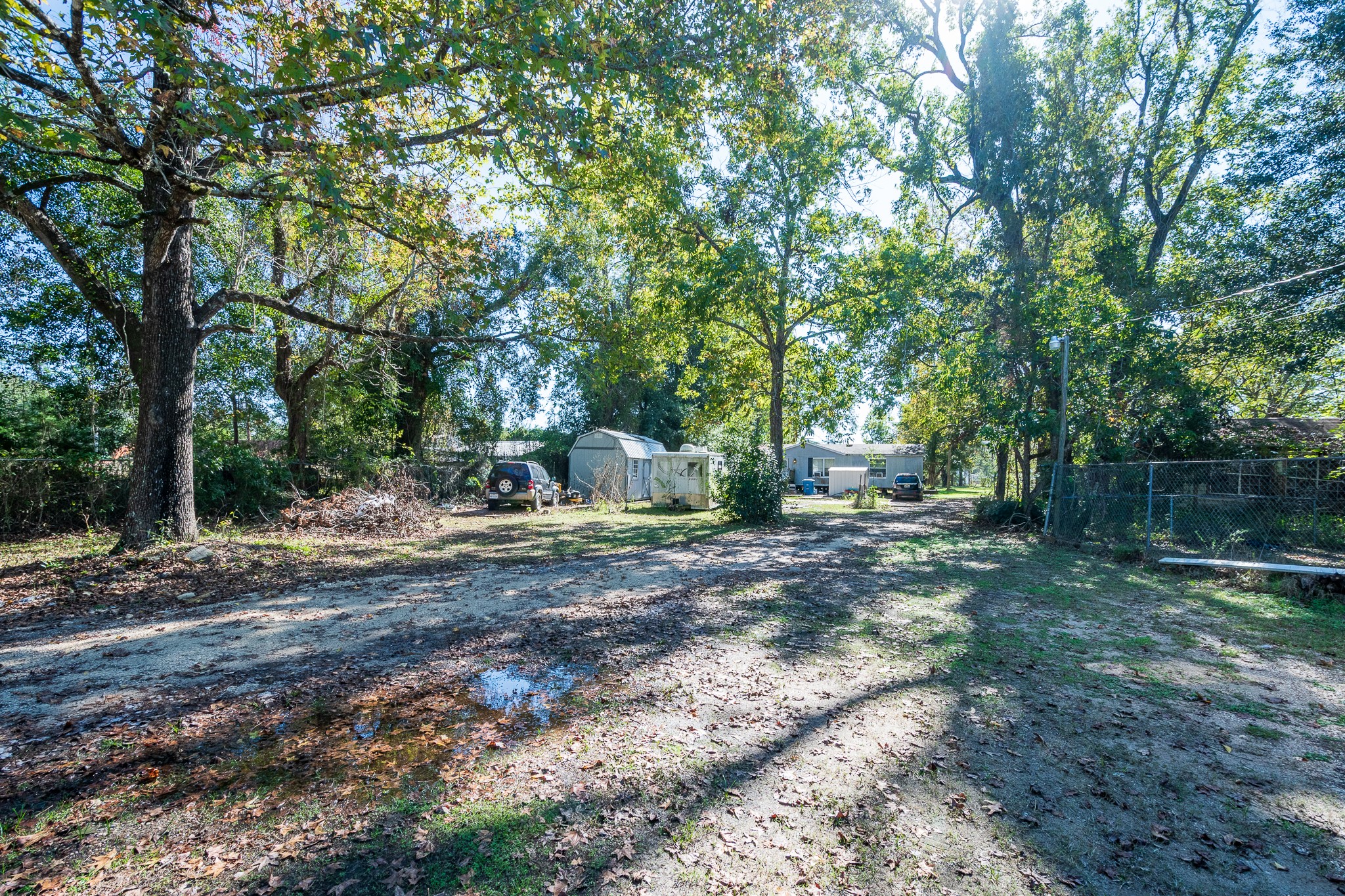 22688 Oakley Road New Caney, TX 77357 - Photo 5 of 11 a backyard of a house with trees and entertaining space