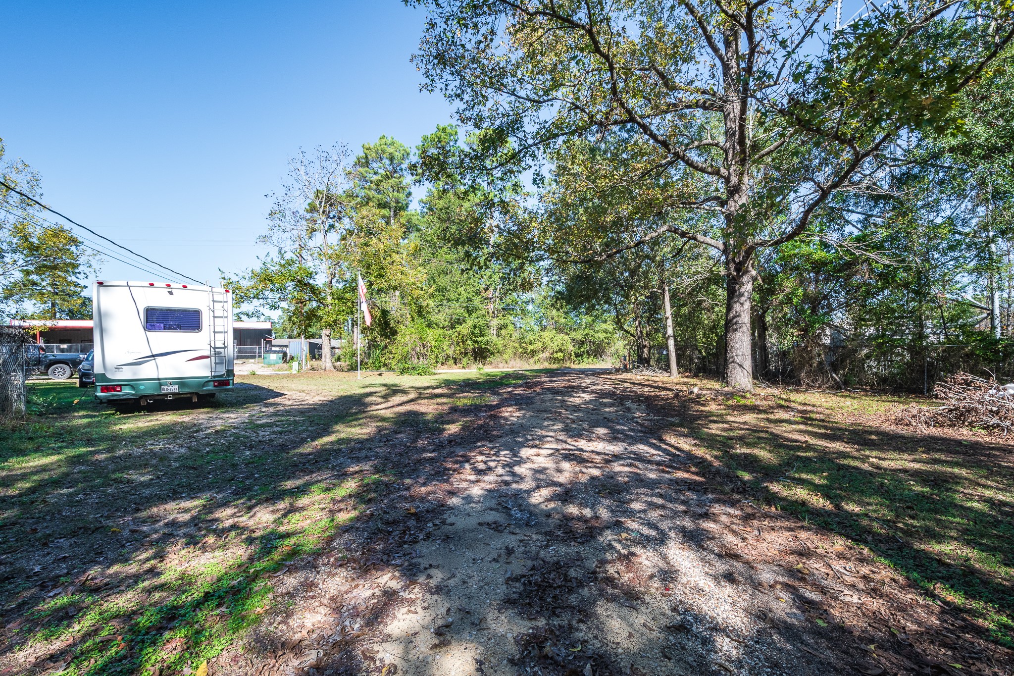 22688 Oakley Road New Caney, TX 77357 - Photo 6 of 11 a view of backyard of house with green space