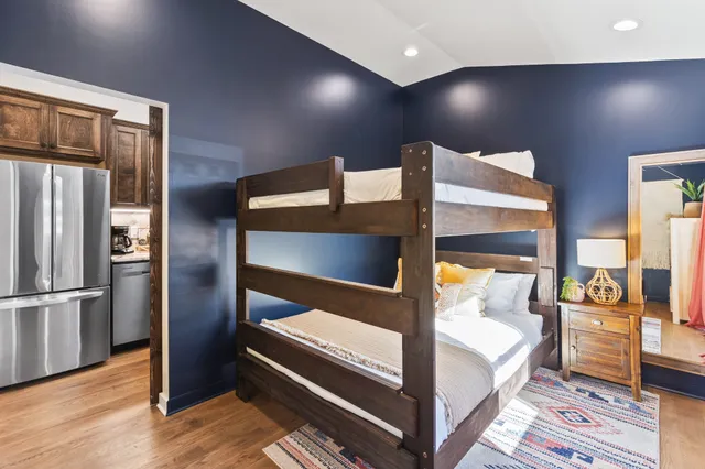 a bathroom with a sink mirror vanity and toilet