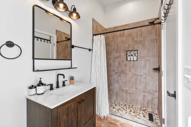 a living room with furniture and a rug