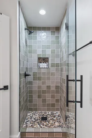 a kitchen with stainless steel appliances granite countertop sink wooden cabinets dining table and chairs