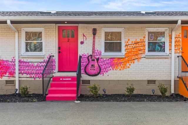 a spacious bedroom with a bed and a couch