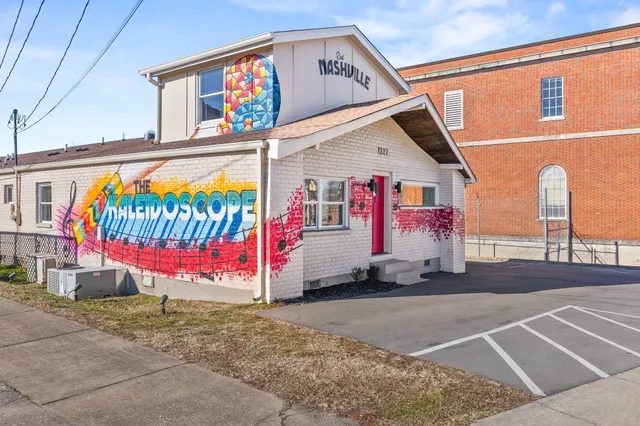 a kitchen with stainless steel appliances granite countertop a stove and a refrigerator