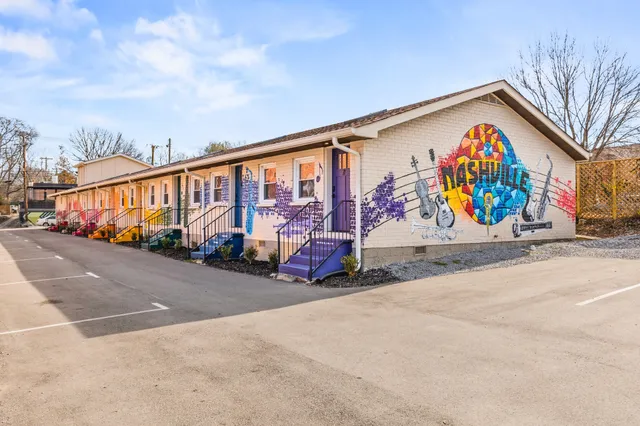 a kitchen with stainless steel appliances granite countertop a sink and stove