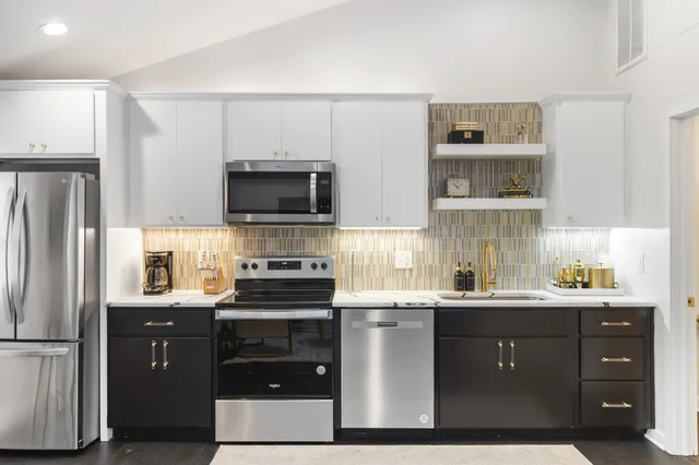 a bathroom with a glass door shower