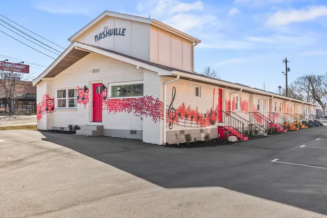 a bathroom with a sink mirror and toilet