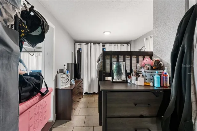 a view of a entryway with storage and utility room