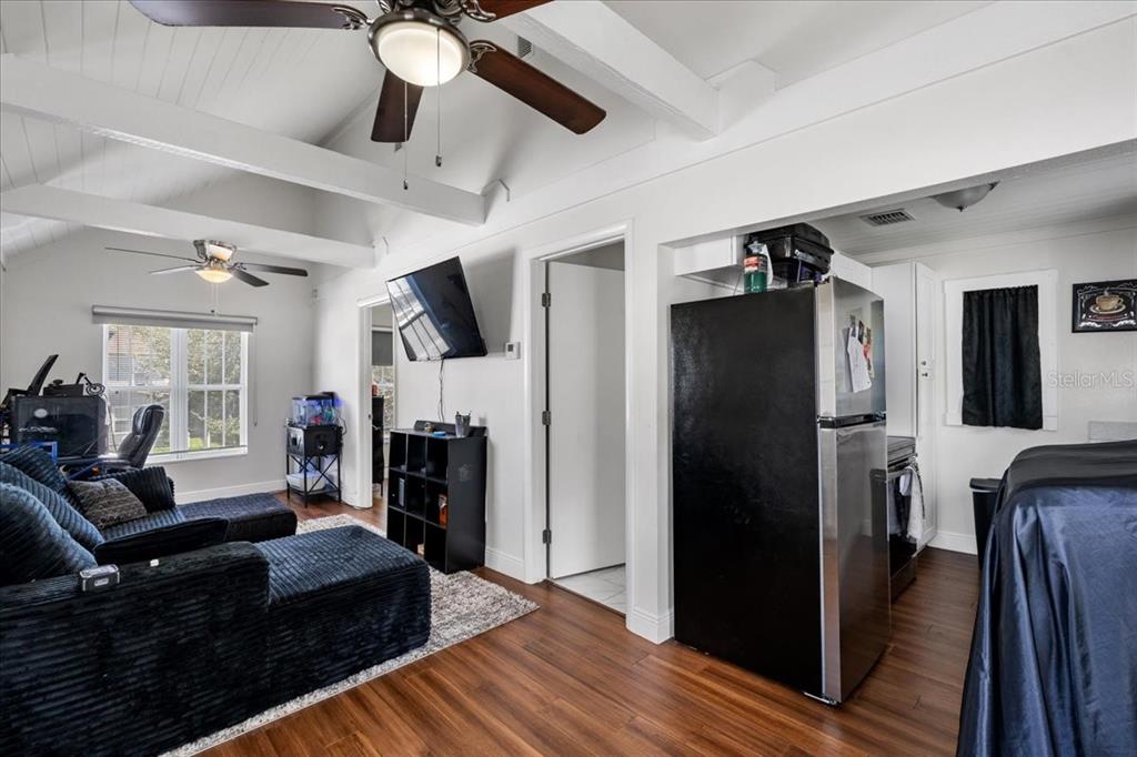 812 West Bryan Street Kissimmee, FL 34741 - Photo 18 of 27 a living room with furniture and a chandelier
