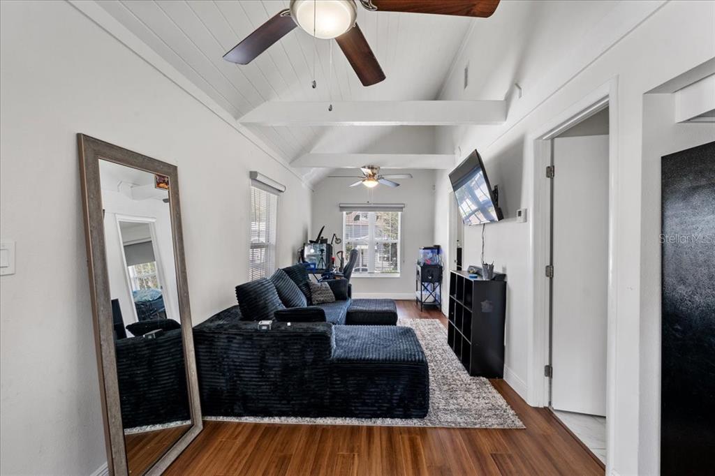 812 West Bryan Street Kissimmee, FL 34741 - Photo 19 of 27 a living room with furniture and a wooden floor