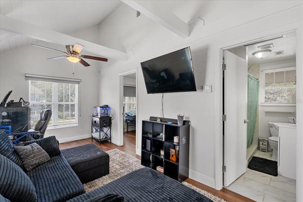 812 West Bryan Street Kissimmee, FL 34741 - Photo 20 of 27 a living room with furniture and a flat screen tv