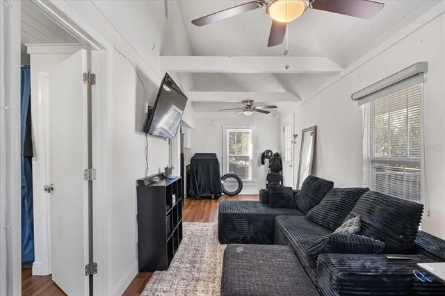 a living room with furniture and a window