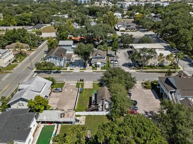 an aerial view of a house with outdoor space