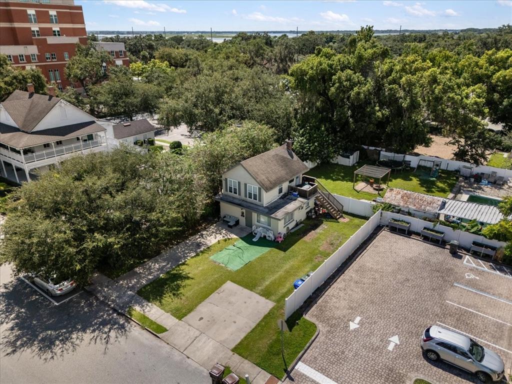 812 West Bryan Street Kissimmee, FL 34741 - Photo 3 of 27 an aerial view of a house with backyard swimming pool and outdoor seating